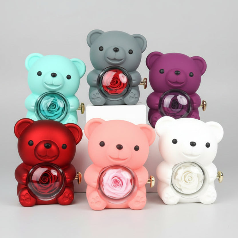 Colorful bear-shaped figurines with rose designs on a pink background